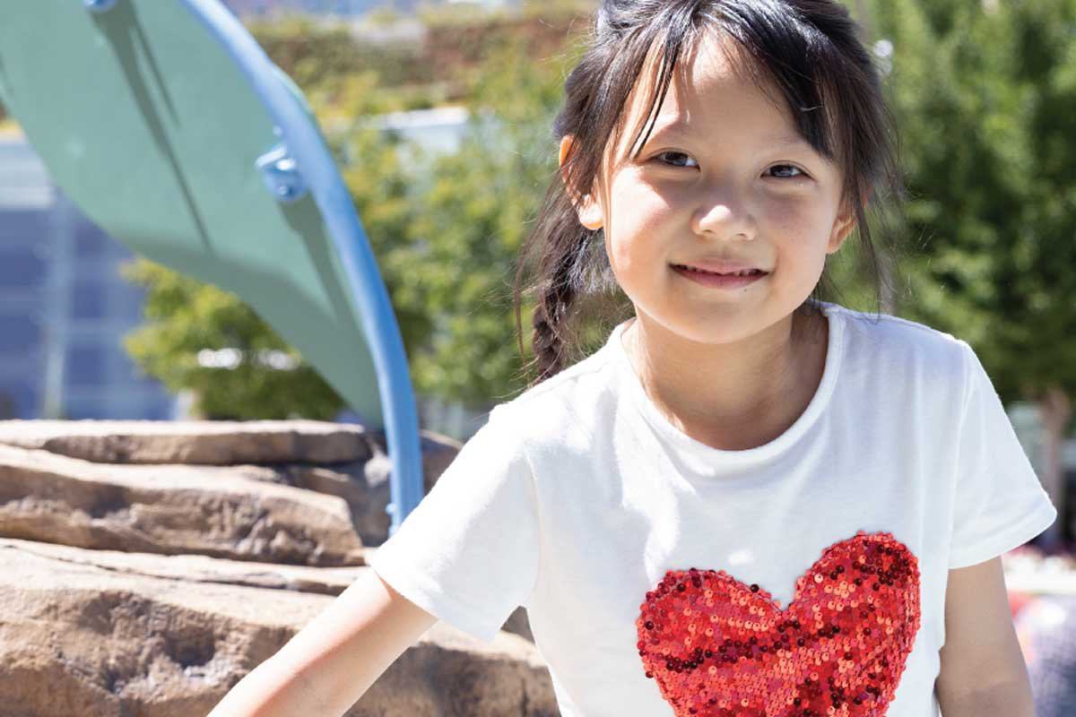 Young girl with a red heart on her tshirt